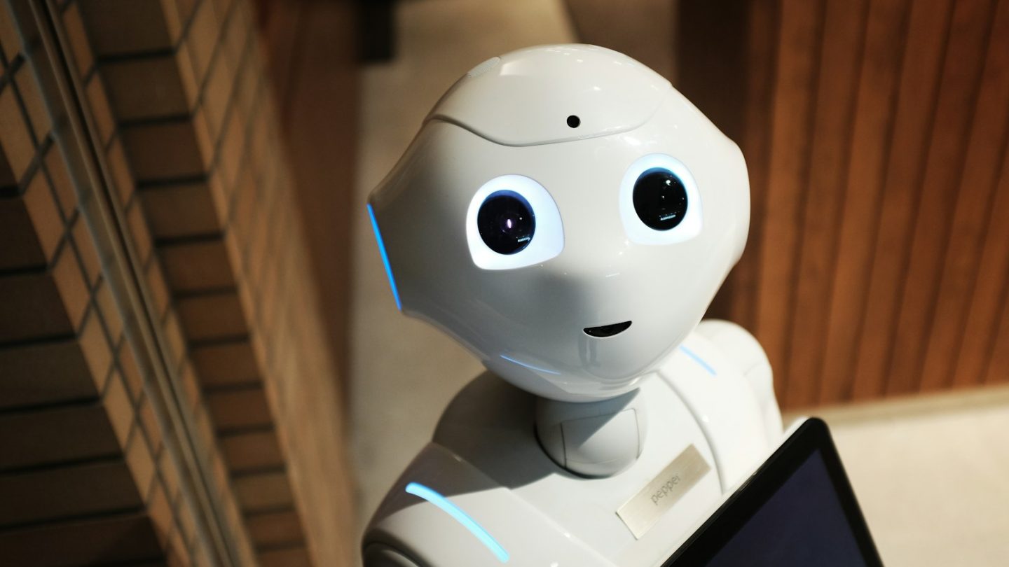 Small white robot used to illustrate a business process automation decision