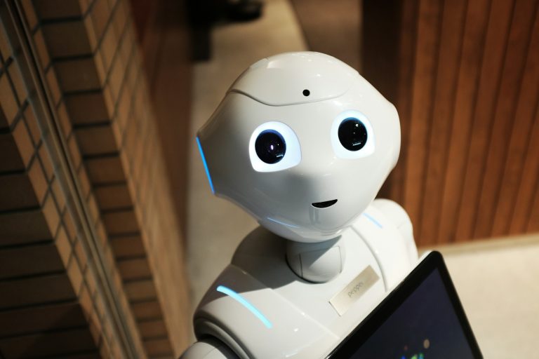 Small white robot used to illustrate a business process automation decision