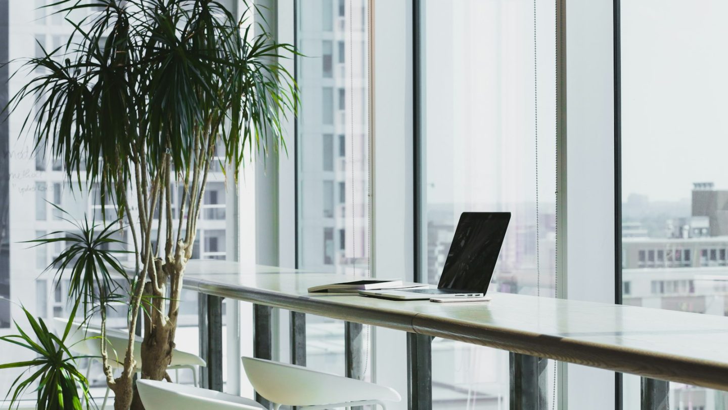 Bright modern office workspace with a laptop, used to illustrate digital transformation for growing businesses