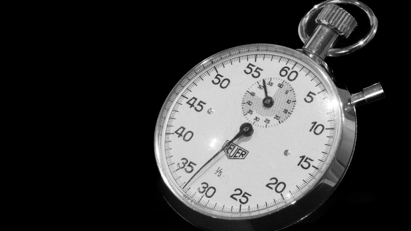 Stopwatch on a black background, representing WordPress page load time