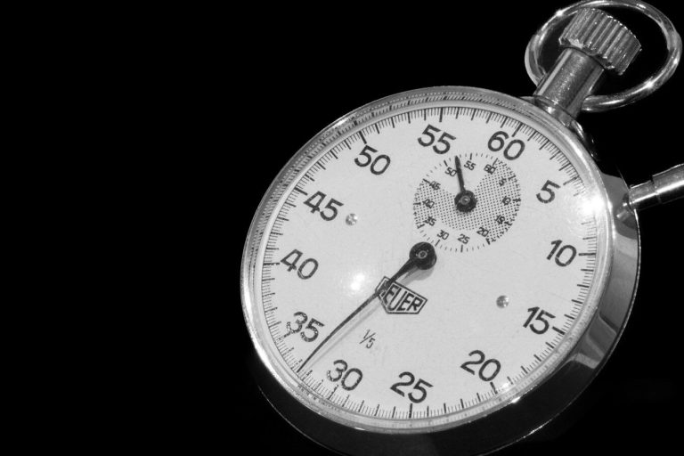 Stopwatch on a black background, representing WordPress page load time