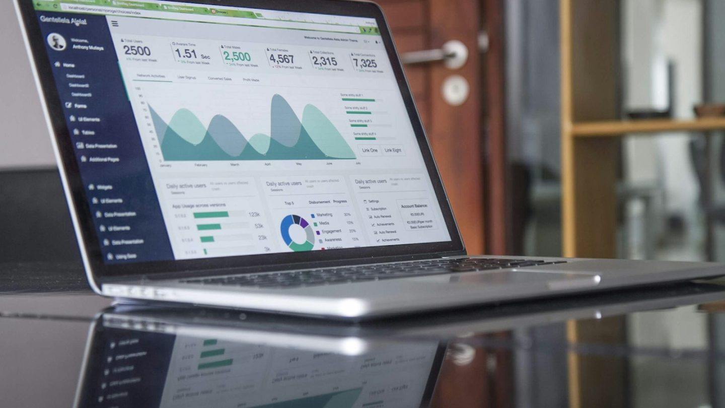 Laptop displaying an analytics dashboard with charts, used to illustrate a technical SEO checklist