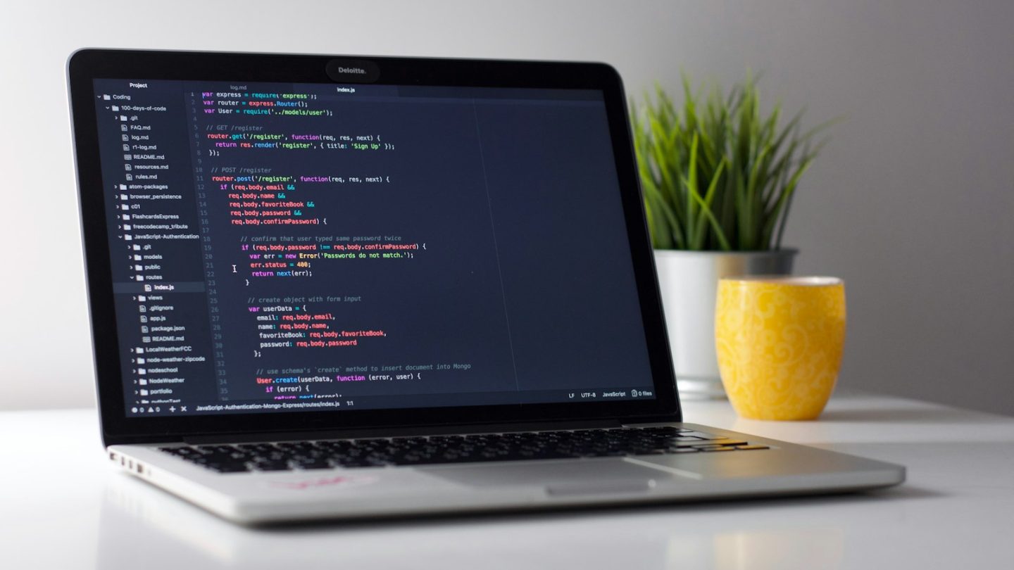 Laptop screen showing code, used to illustrate a WordPress site speed audit